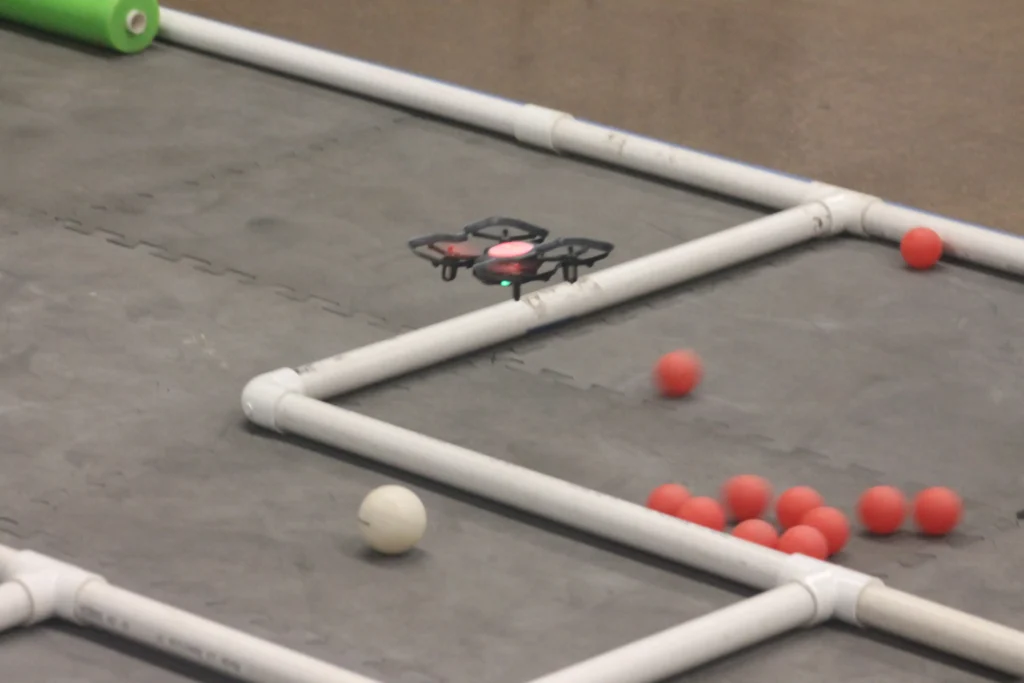 A drone navigating an obstacle course at the Ke Ala Hou STEM Camp