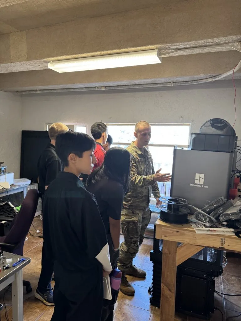 A student handling a drone at Lightning Labs